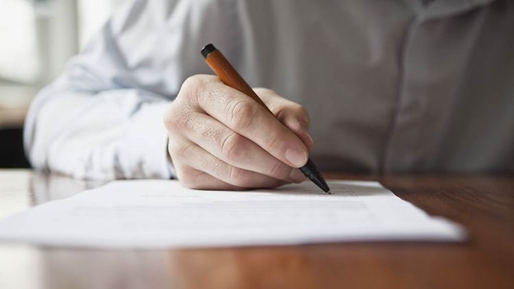  Man signing a document