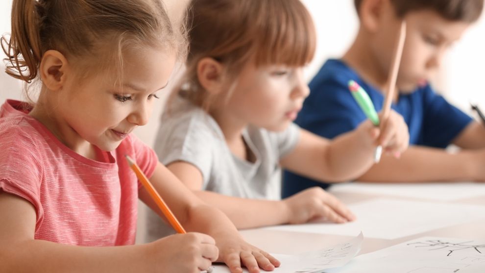 kids drawing in classroom